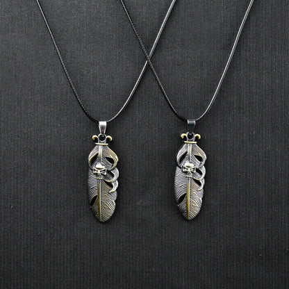 Pair of Golden Feather & Skull pendant with Black rope